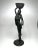 The beautiful bronze like patina of this figurine enhances the details. The African woman is carrying a basket and a...