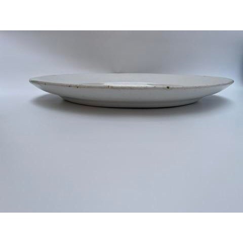 A single large oval antique white ironstone platter.