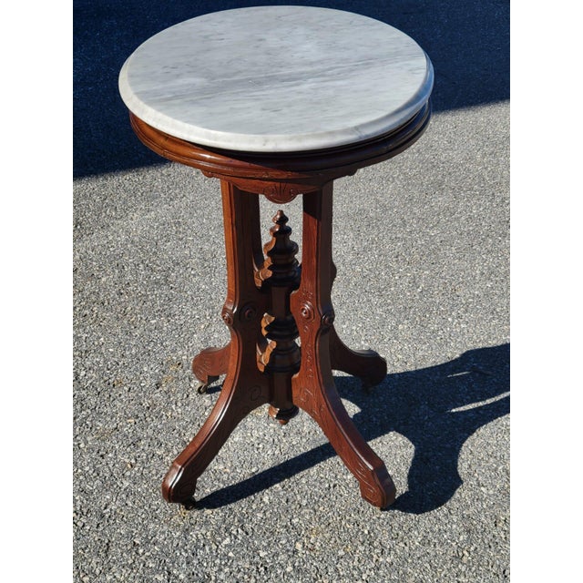 Add a touch of historic Americana to your home with this stunning antique American Victorian parlor table. Featuring a...