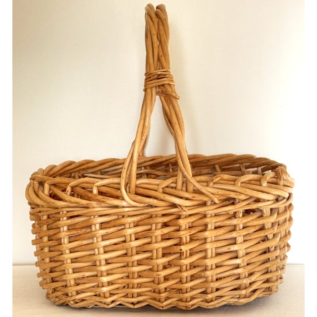 This is a large hand made rattan basket from the late 1990s. It is probably Asian in origin. It is 21" in diameter and...