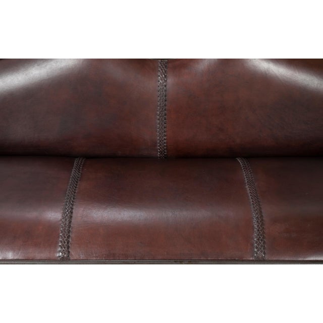 French baroque style iron and leather settee circa 1970's. Very handsome and elegant hand crafted wrought iron and leather...