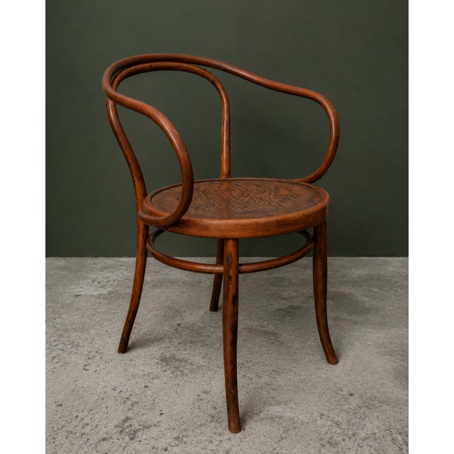 This iconic chair by j. & j. Kohn elegantly exemplifies the refined elegance of early 20th-century viennese furniture....