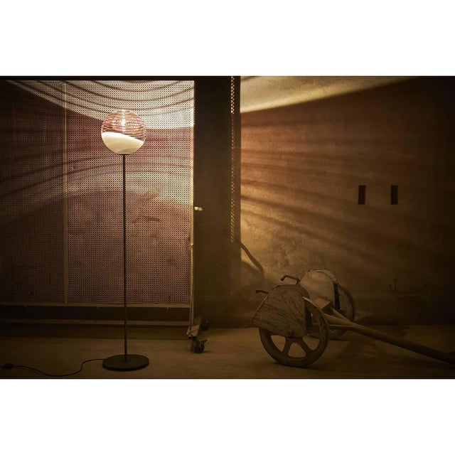 Floor lamp of Murano transparent and white glass on anthracite painted iron base with 20 watt LED bulb. Carlo Moretti: An...