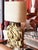 A true conversation piece, this sculptural table lamp features a hand-made wooden base of layered wooden pieces in bold,...