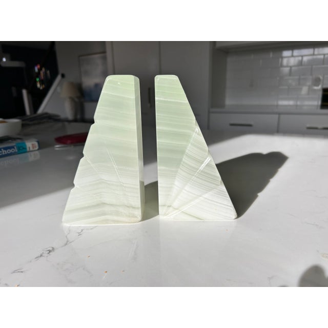 Elegant Mid-Century Onyx Marble Bookends – Light Green & White with Etched Sunburst Detail Add timeless sophistication to...