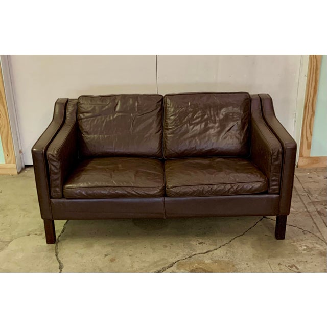 This Danish two seater sofa in brown leather has great patina, perfect for any room in your home