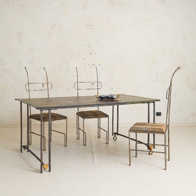 Designed by Jean-Jacques Argueyrolles, this French Brutalist wrought iron and gold leaf dining table is a study in...