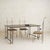 Designed by Jean-Jacques Argueyrolles, this French Brutalist wrought iron and gold leaf dining table is a study in...