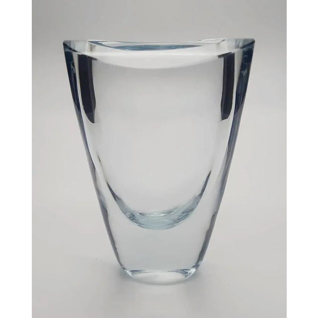 This is a circa 1950s handblown glass bud vase by Astra Stromberg in hues of the very pale blue that Strömbergshyttan is...