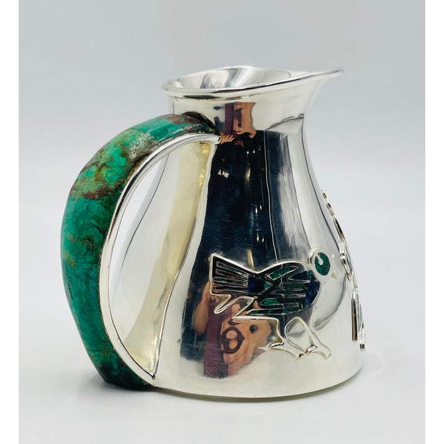 A striking example of Mexican Modernism and Taxco silversmithing, this exceptional mid-century water pitcher was designed...