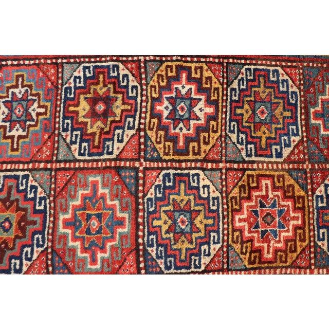 Measures: 4'10 x 8'9 Antique Caucasian Kazak Rug with Red Field and Star Medallion Design. Keivan Woven Arts/...