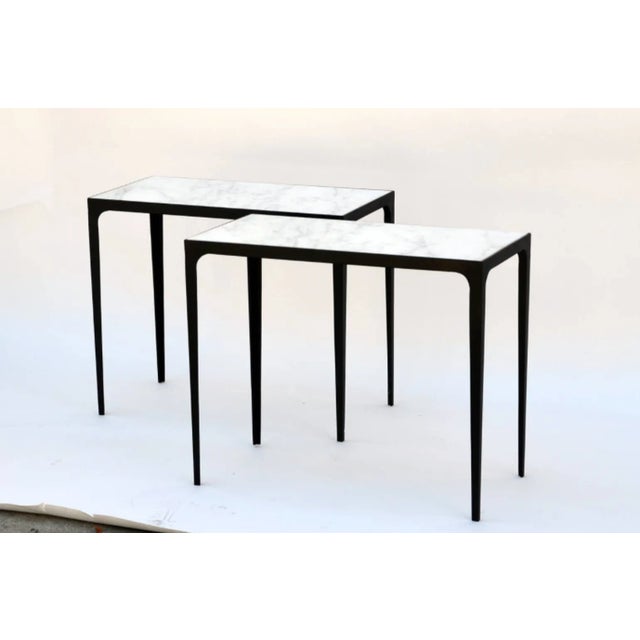 Pair of ‘Esquisse’ wrought iron and honed marble side tables in the style of Jean-Michel Frank.