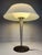 Mid-Century Modern table lamp designed by Gerald Thurston for Lightolier. This is a classic "flying saucer" or mushroom-...