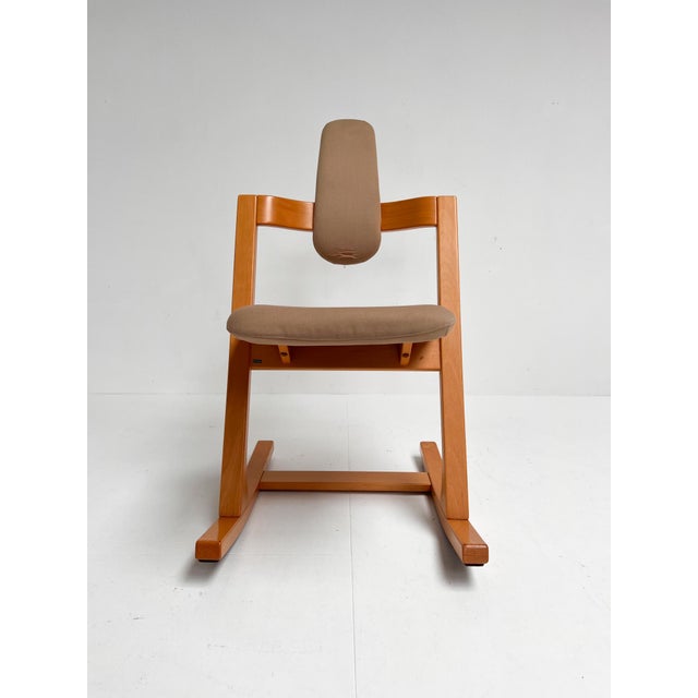 This is the Stokke Pendulum chair by Peter Opsvik from 1983. The Scandinavian chair with a curved beech wood base is a...