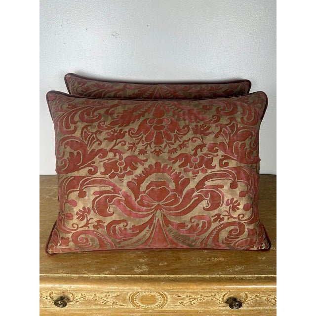 A striking pair of decorative pillows crafted from authentic Fortuny textiles, showcasing an elegant, large-scale...