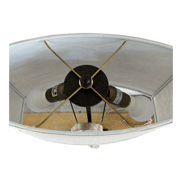 Stylish Regina Andrew Carved Wing Lamps. Wood wings on black base. Oval Linen shade. Showroom floor sample.