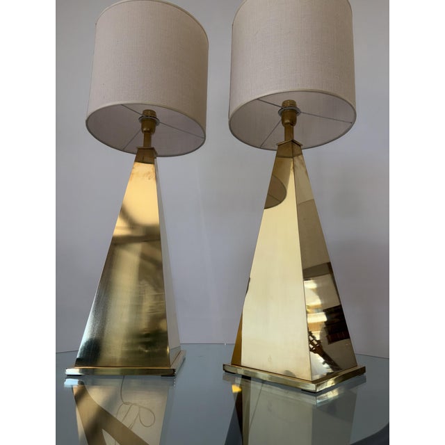 Impressive pair of pyramid-shaped brass table lamps with fabric lampshades European Plug (up to 250V).The wiring of this...
