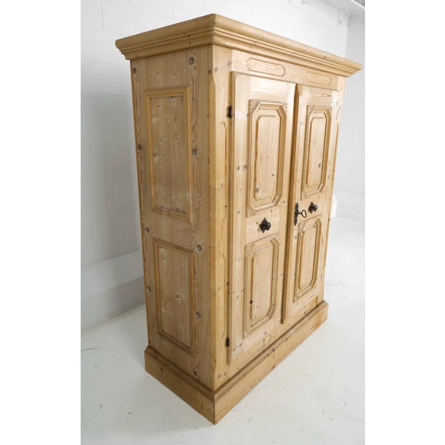 Crafted by renowned Austrian furniture maker Voglauer, this handsome solid pine wardrobe embodies the warmth and enduring...