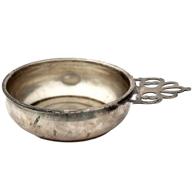 American reproduction sterling silver porringer Round body with ornate keyhole pierced handle.