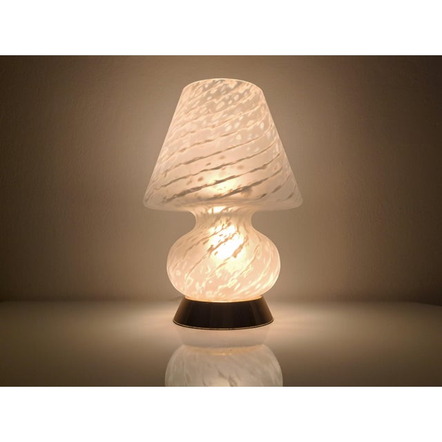 Murano glass mushroom swirl lamp with a gold base. Made in Murano in the 1970s, this mushroom-shaped lamp will bring a...