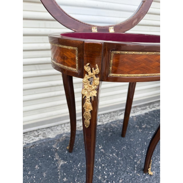Add a refined touch of French elegance to your space with this exquisite Louis XV-style side table, masterfully crafted...