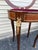 Add a refined touch of French elegance to your space with this exquisite Louis XV-style side table, masterfully crafted...