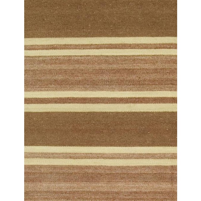 A vintage Turkish Kilim runner handwoven in the 1940s, featuring timeless stripes that blend effortlessly into both modern...