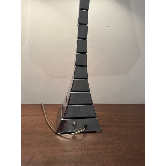 Modern 1970s pair of mid-century lamps. Stacked polished chrome segments in an hours glass form these also resemble the...