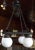 Very stylish and unusual chinoiserie, black metal faux bamboo chandelier. Square horizontal faux bamboo framework with...