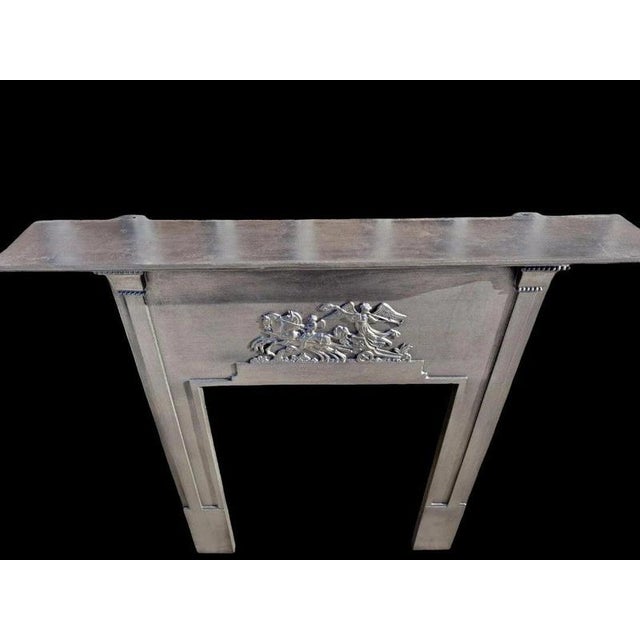 An exceptional and unusually designed antique cast iron fireplace surround dating from the late victorian to early...