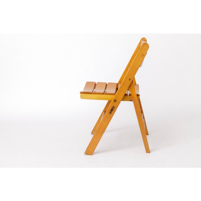 Vintage Folding Chair in Beech Wood – Germany, 1950s–1960s Unknown manufacturer Elegant vintage folding chair from the...