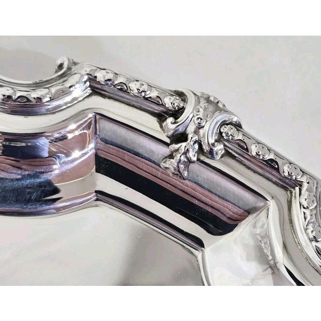 A substantial George VI sterling silver salver, tray or waiter dating to 1947, displaying exceptional quality and an...