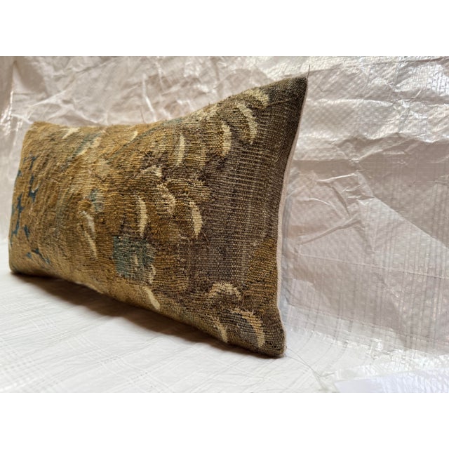 This decorative pillow is crafted from a genuine fragment of a 17th century Brussels tapestry, woven in the Flemish...
