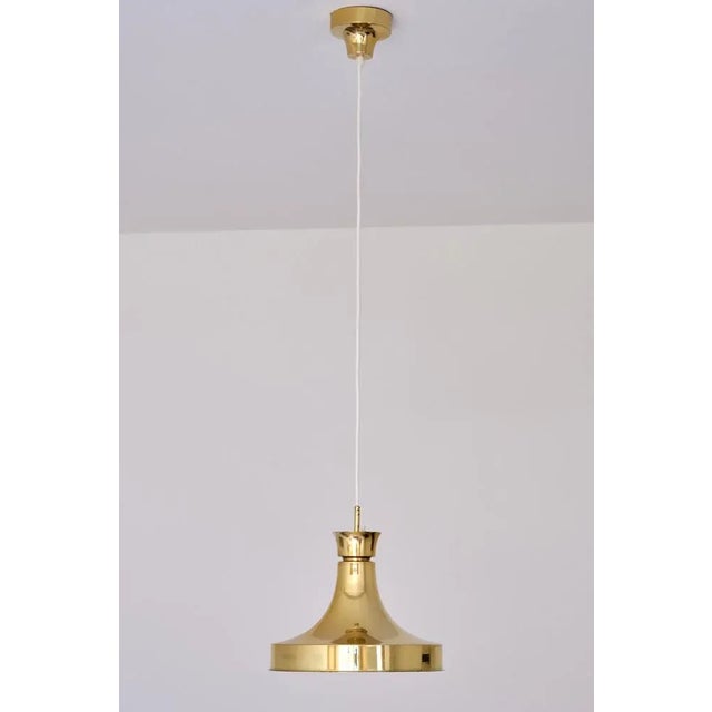 This striking brass pendant light was produced by ab fagerhults belysning in sweden in the early 1960s. The elegant...