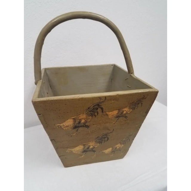 This is a wooden carry box is decoupaged in roosters. The box is antique and the decoupage was done by an artist in...