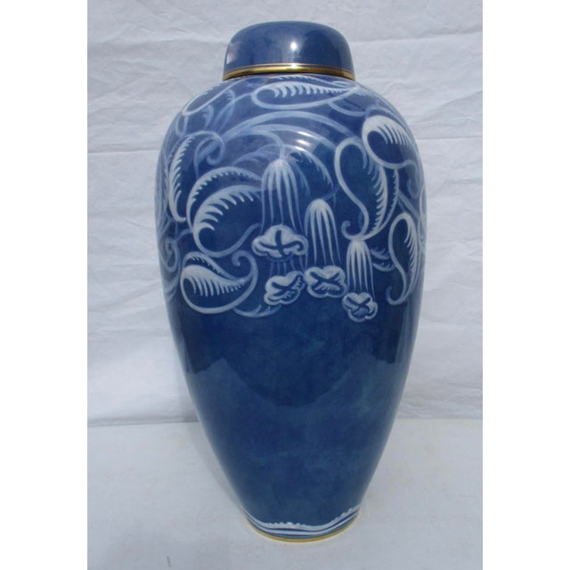 Collectors Sevres lidded jar in dark blue with Art Deco floral designs over shoulders. Studio artwork is unique....