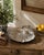 A striking late-19th-century English serving dish fashioned as a deeply fluted scallop shell. The silver-plated surface...