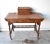 An antique, Victorian writing desk with burl walnut veneer and stringing, a baluster rail at the base to serve as...