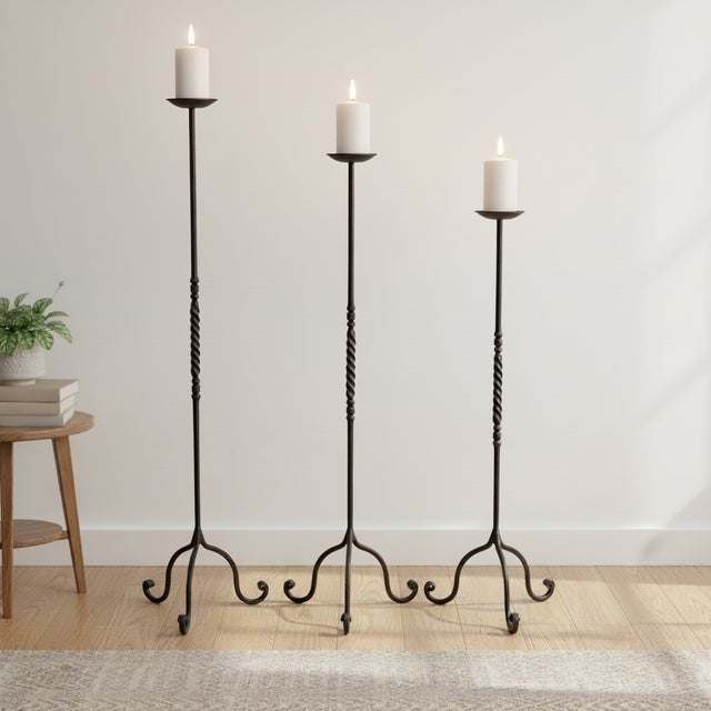 The Grand Twist Trio: Floor Candelabra Set ️ For those who prefer a more substantial presence, this Hand-Forged Iron Set...