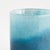 A modern update to the simple glass vessel, the Del Mar Glass Hurricane is made of vibrant shades of blue. The color is...