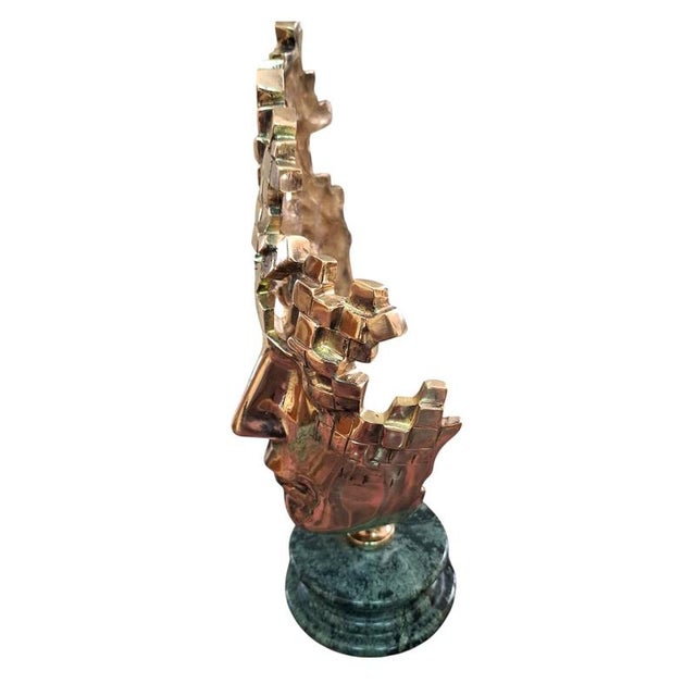Dimensions: 35 cm high x 10 cm base diameter; bronze with a Guatemalan marble base. Masks have always been a symbol of...