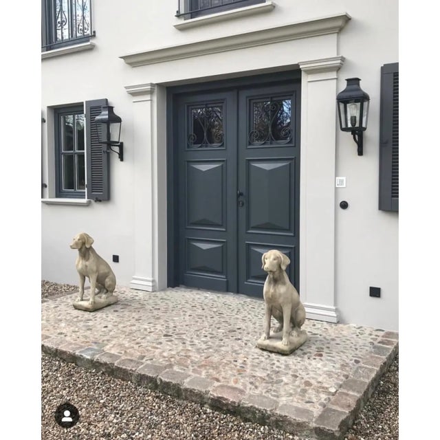 Small lantern with pagoda structure in dark bronze with outside fitted clear glass, mounted on a support bracket in black...