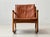 This distinctive lounge chair from france & son embodies the warm, organic design language of danish mid-century modernism...