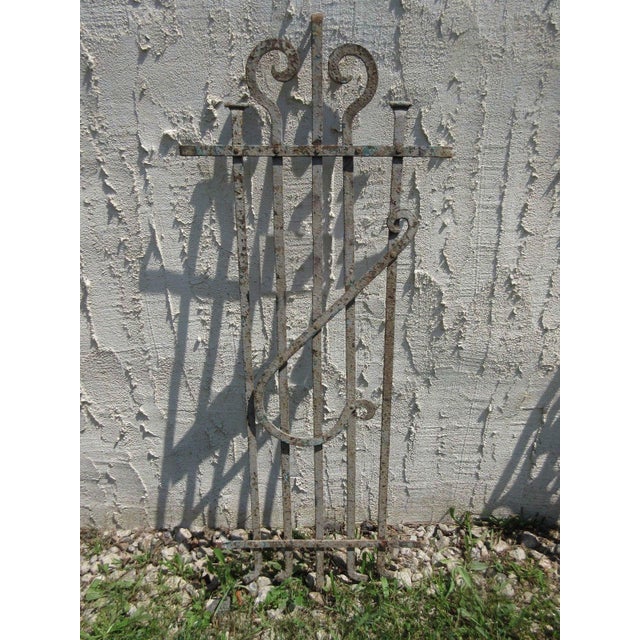 This gate is a wonderful piece of architecture. Heavy, tight, and sturdy. The piece does show signs of age related wear...