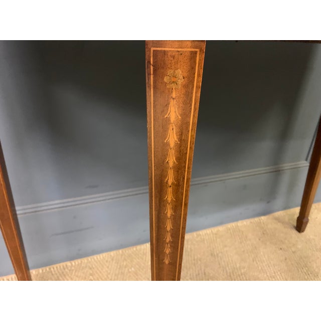 A fine quality Sheraton revival , Edwardian period inlaid mahogany card table. Of demi lune form and of very good...