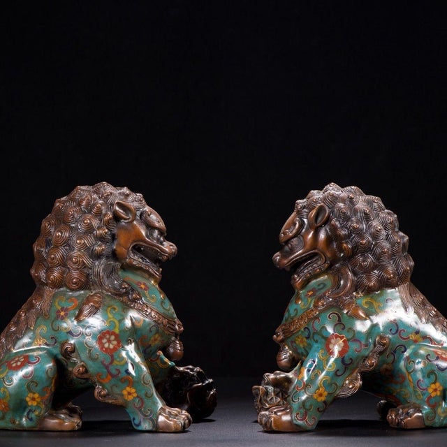 This is a striking pair of vintage cloisonné enamel guardian lions, also known as Foo Dogs or scholar's desk lions. Each...