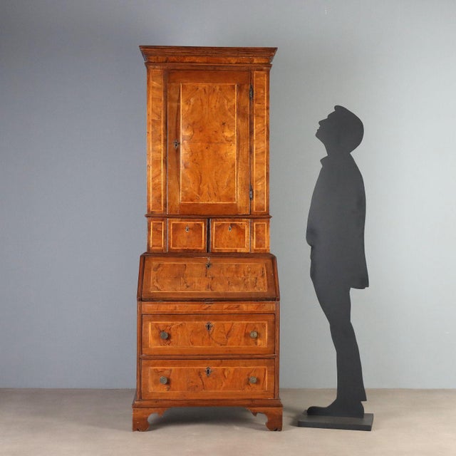 Late 18th-century Italian trumeau crafted in walnut and burl walnut, enhanced with elegant maple inlays. The upper section...