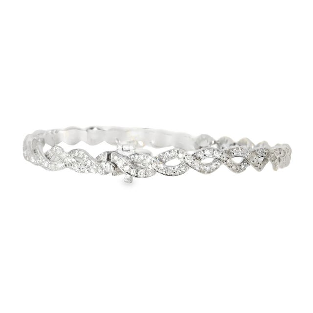 Estate 14K White Gold Twisted Diamond Bracelet. This exquisite bracelet features 215 brilliant round diamonds, with a...