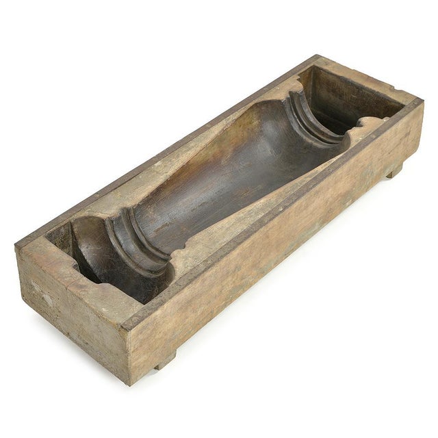 This remarkable handcrafted mold, carved from a solid block of wood, offers a striking testimony to the expertise of old...