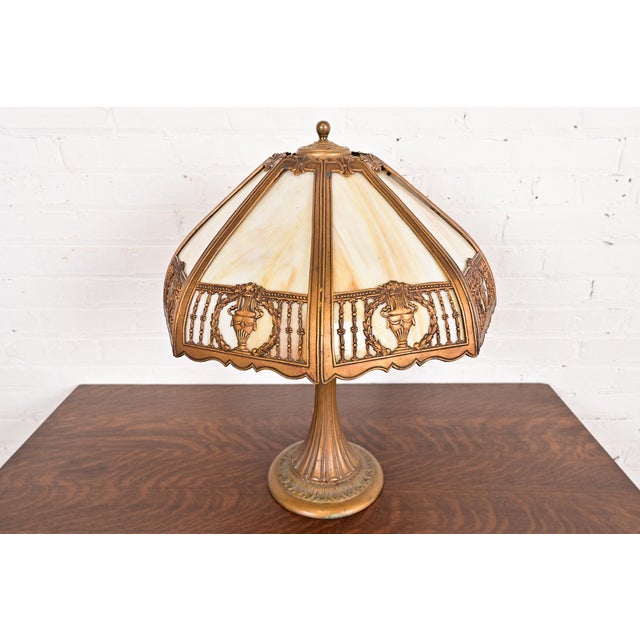 An exceptional antique Art Nouveau or Arts & Crafts period table lamp with wreaths and urns and gorgeous eight-panel...